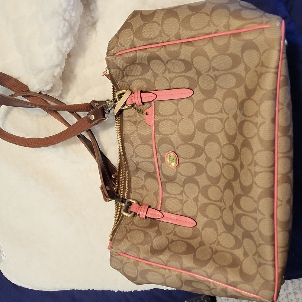 Coach medium sized tan and coral logo'd purse